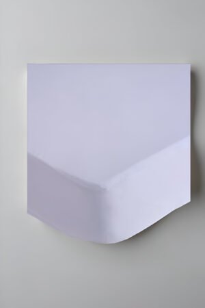 Protector de colchón rizo 90x190 cm blanco sobre cama.